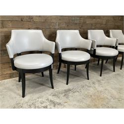 Four ebonised framed tub shaped armchairs, upholstered in grey fabric