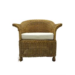 Rattan armchair and ottoman set, pair of armchairs featuring rounded backrests with wide armrests, woven wicker frame with weaving and upholstered seat cushions in off-white fabric with flowing floral pattern (W83 D80 H78cm); matching round ottoman with upholstered cushion on square wooden feet (W65 D65 H37cm)