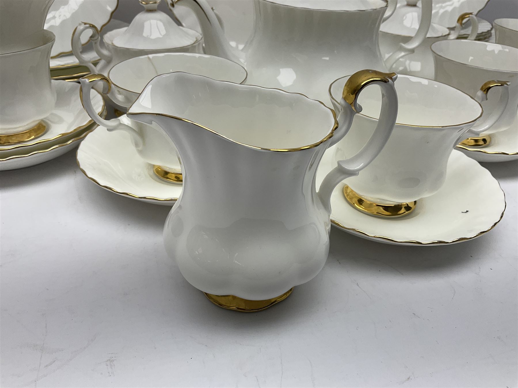 Royal Albert Val D'or pattern tea service for six, comprising teapot, milk jug, sucrier, six teacups and saucers, tea plates, side plates, dessert plates, etc (33)