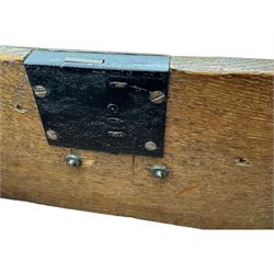 Victorian carved oak kneehole desk, the rectangular top with carved edge, above central drawer with carved front and brass handles, central kneehole with cupboard door, flanked by two banks of three graduating drawers each with similarly carved decoration, on shaped plinth base with castors