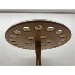 Pine stick stand, with turned central column dividing two circular tiers, upon three feet, with capacity for twenty four walking sticks, H73cm