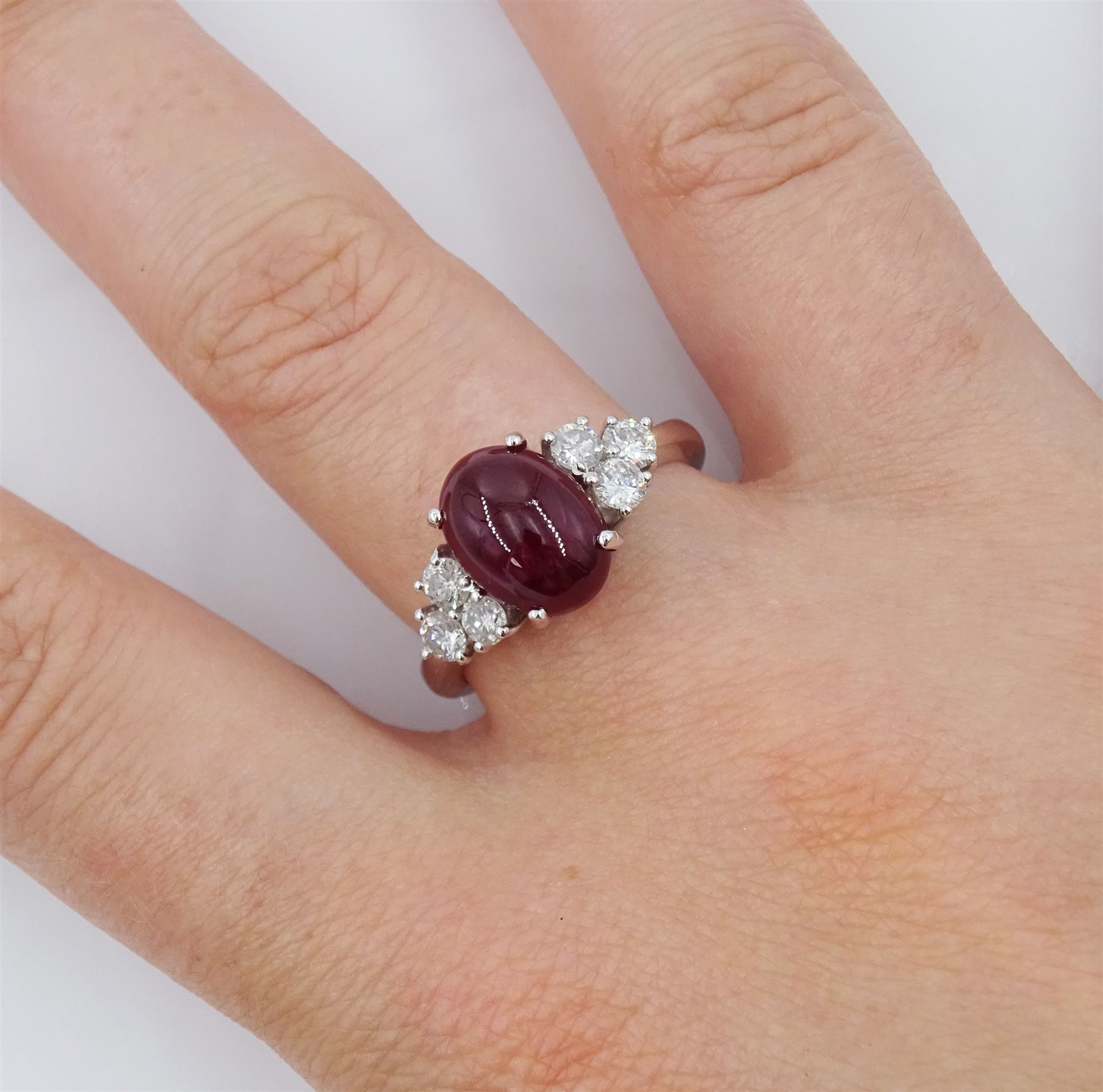 18ct white gold cabochon cut ruby and six stone round brilliant cut diamond ring, hallmarked, ruby approx 3.70 carat, total diamond weight approx 0.55 carat