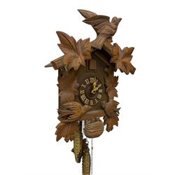 German 1960's cuckoo clock with automata - traditional styled case and dial with a cuckoo sounding the hours and half-hours, twin chain driven movement and automata feature of two carved cuckoos to the front of the case simultaneously moving as the hours are struck. With weights and pendulum.  