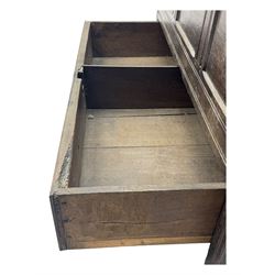 18th century oak mule chest, rectangular plank top with moulded edge, enclosing candle box with internal divisions, panelled front with applied moudlings, fitted with single drawer to the base with brass swing handle, on stile supports