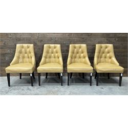 Four high back chairs upholstered in buttoned beige leather, studded detail, rosewood legs