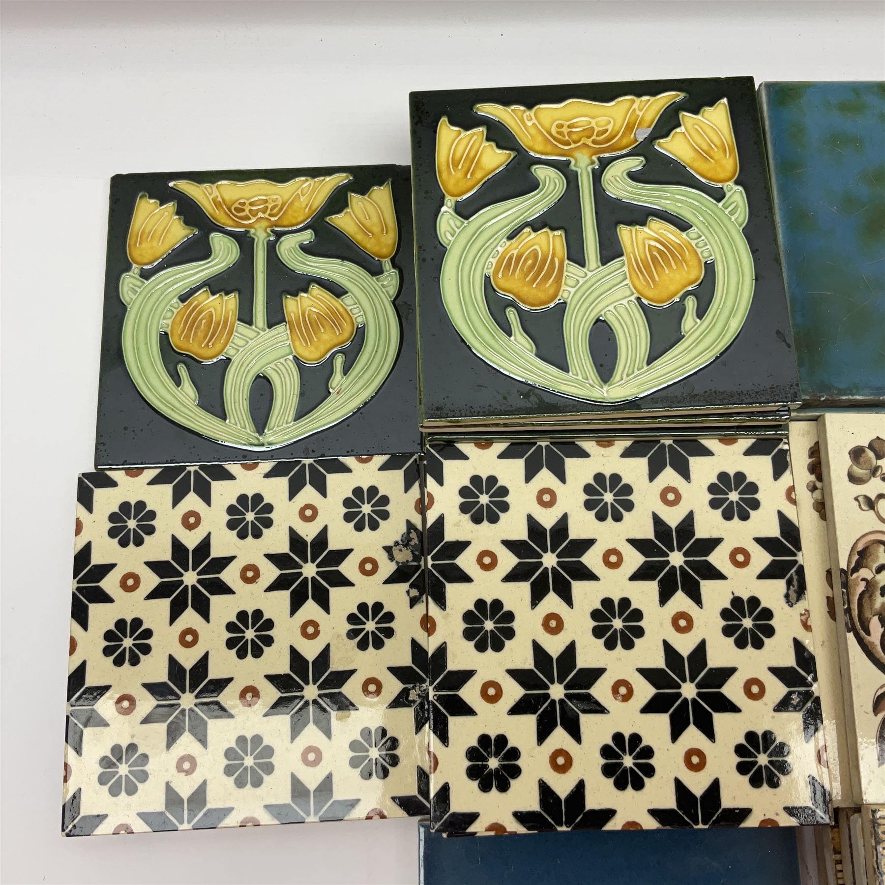 Collection of Victorian and later tiles to include floral and tube line examples