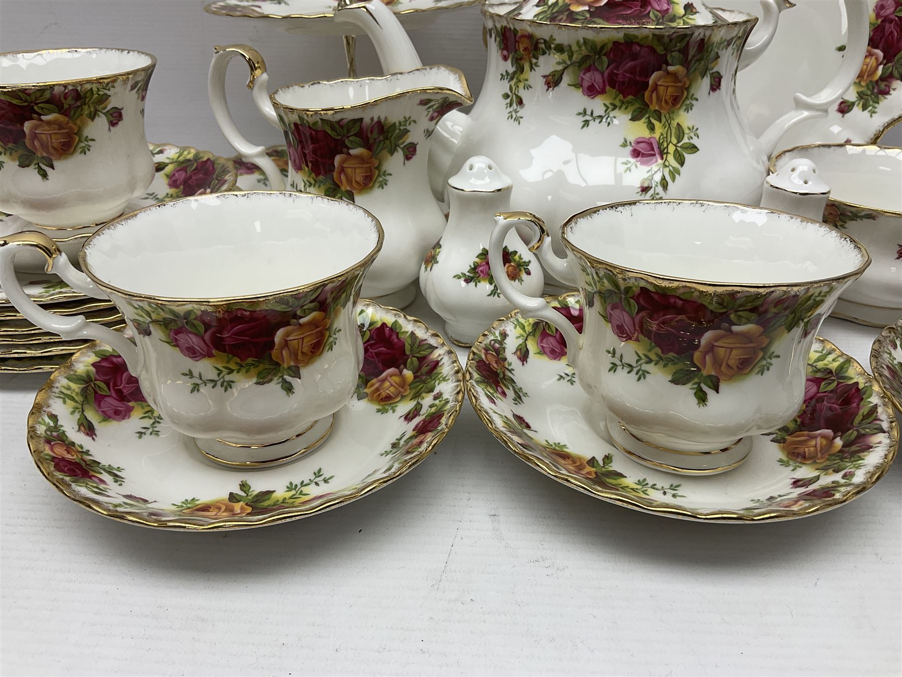 Royal Albert Old Country Roses pattern tea service for six, comprising teapot, sucrier, milk jug, dessert plates, one cake plate, one two tiered cake stand, salt and pepper pots and bud vase 