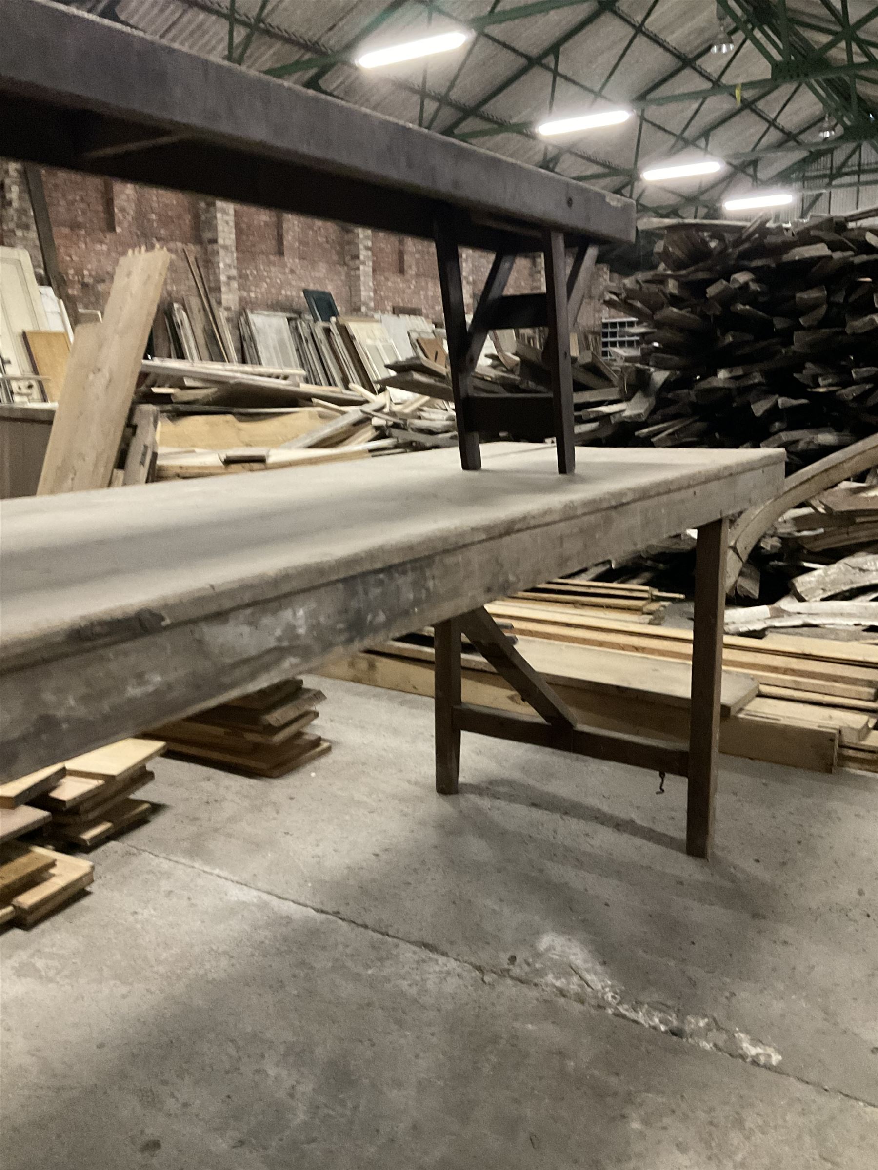 20the century pine folding table, rectangular top on square supports joined by stretchers (244cm x 68cm, H76cm); together with a similar folding bench (181cm x 25cm, H43cm) - THIS LOT IS TO BE COLLECTED BY APPOINTMENT FROM THE OLD BUFFER DEPOT, MELBOURNE PLACE, SOWERBY, THIRSK, YO7 1QY