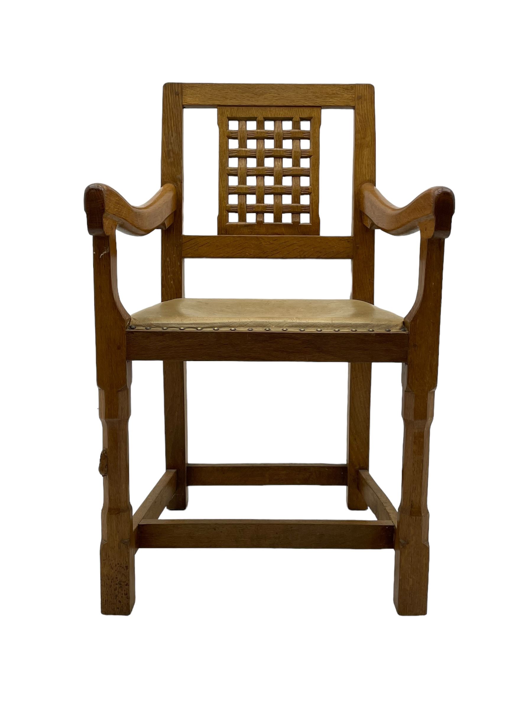 Rabbitman - set of six (5+1) oak dining chairs, pierced and carved lattice back, leather upholstered seat with stud band, on octagonal supports united by stretchers, carved with rabbit signature, by Peter Heap of Wetwang 