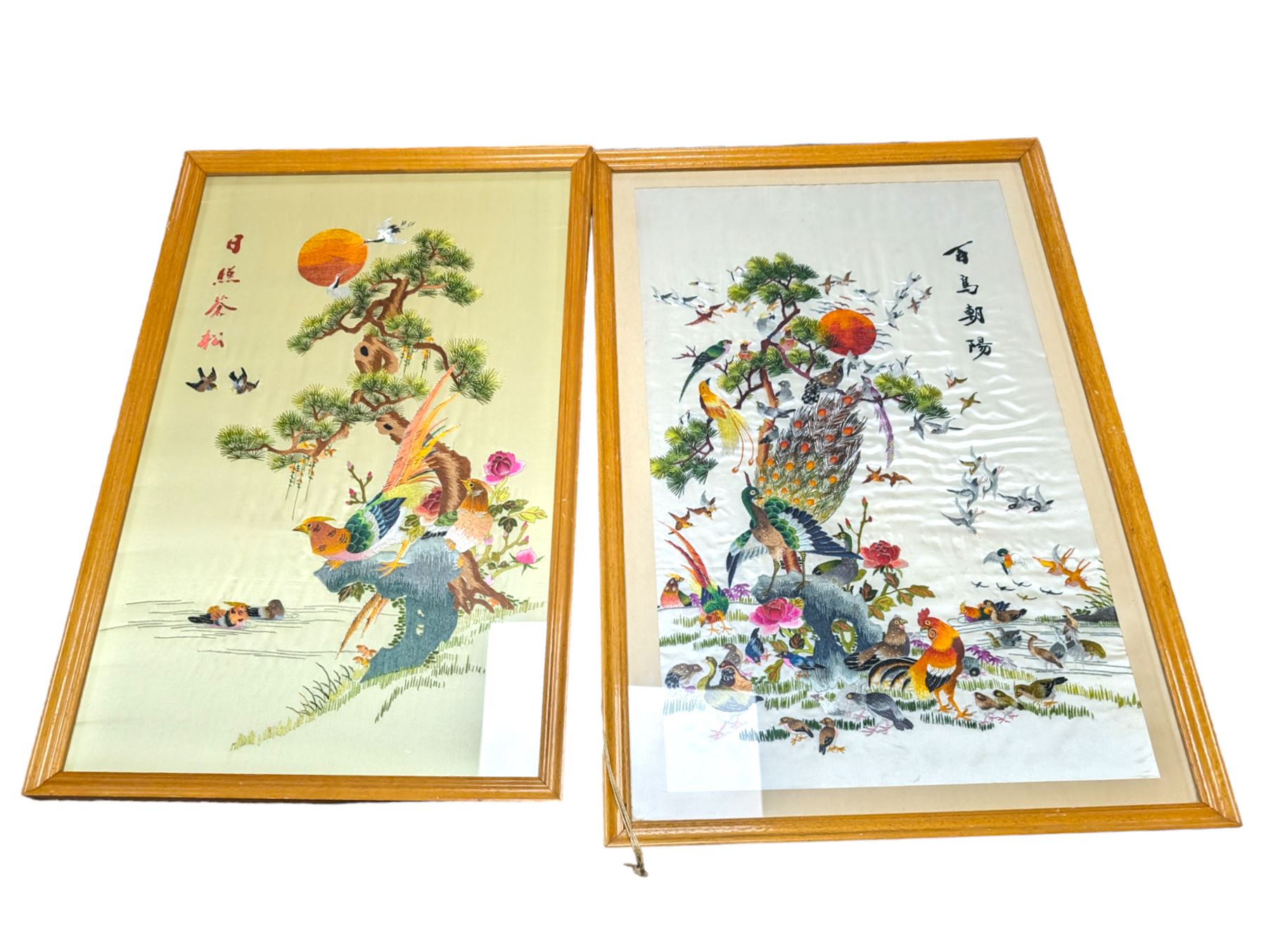 Two mid century Chinese embroidered silk panels, in wooden frames 