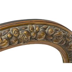 20th century giltwood and gesso oval wall mirror, the frame decorated with moulded fruit and foliage, bevelled mirror plate 