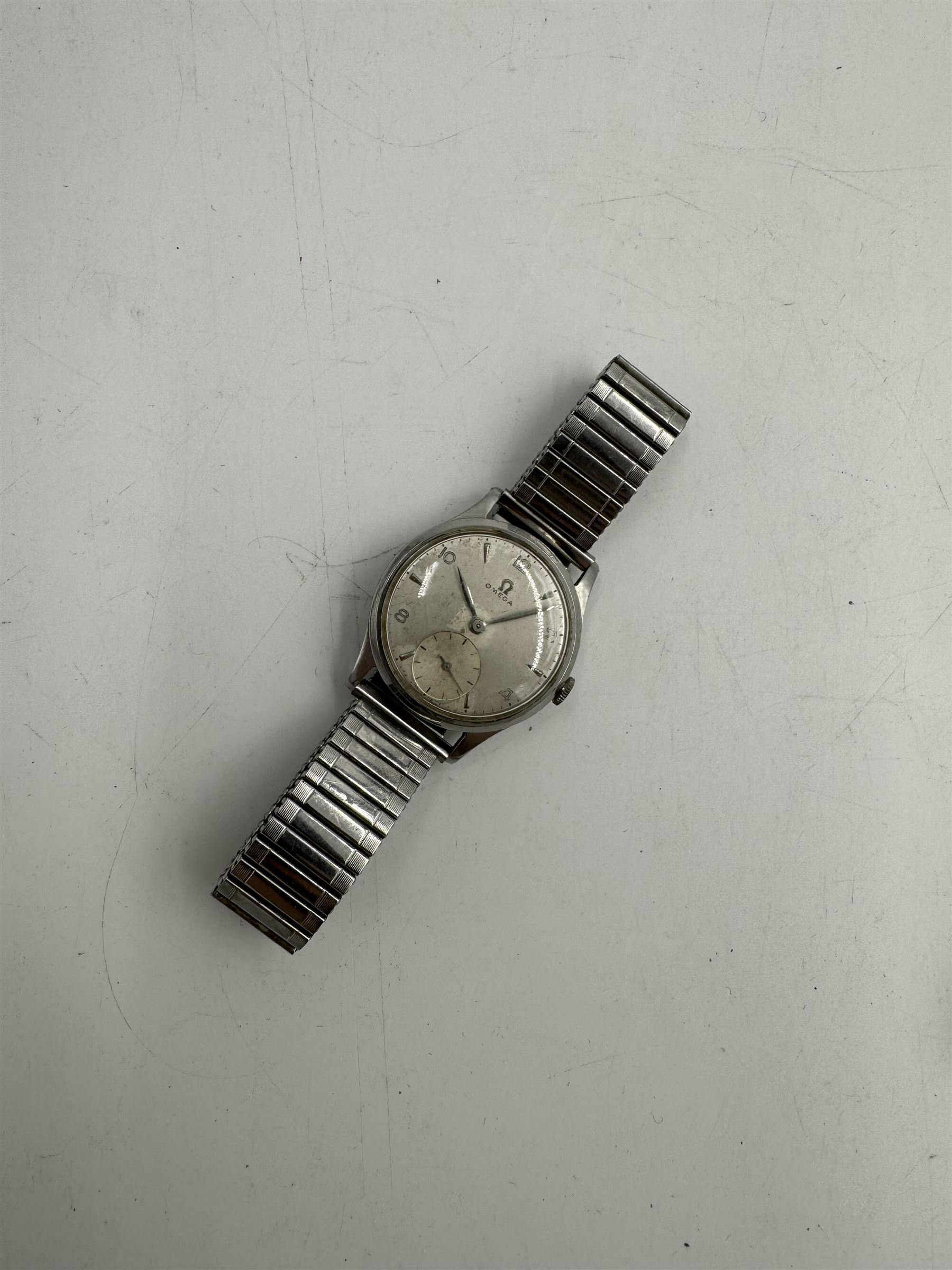 Omega gentleman's stainless steel manual wind wristwatch, Cal. 265, silvered dial with subsidiary seconds dial, on expanding strap and an Omega Constellation automatic wristwatch