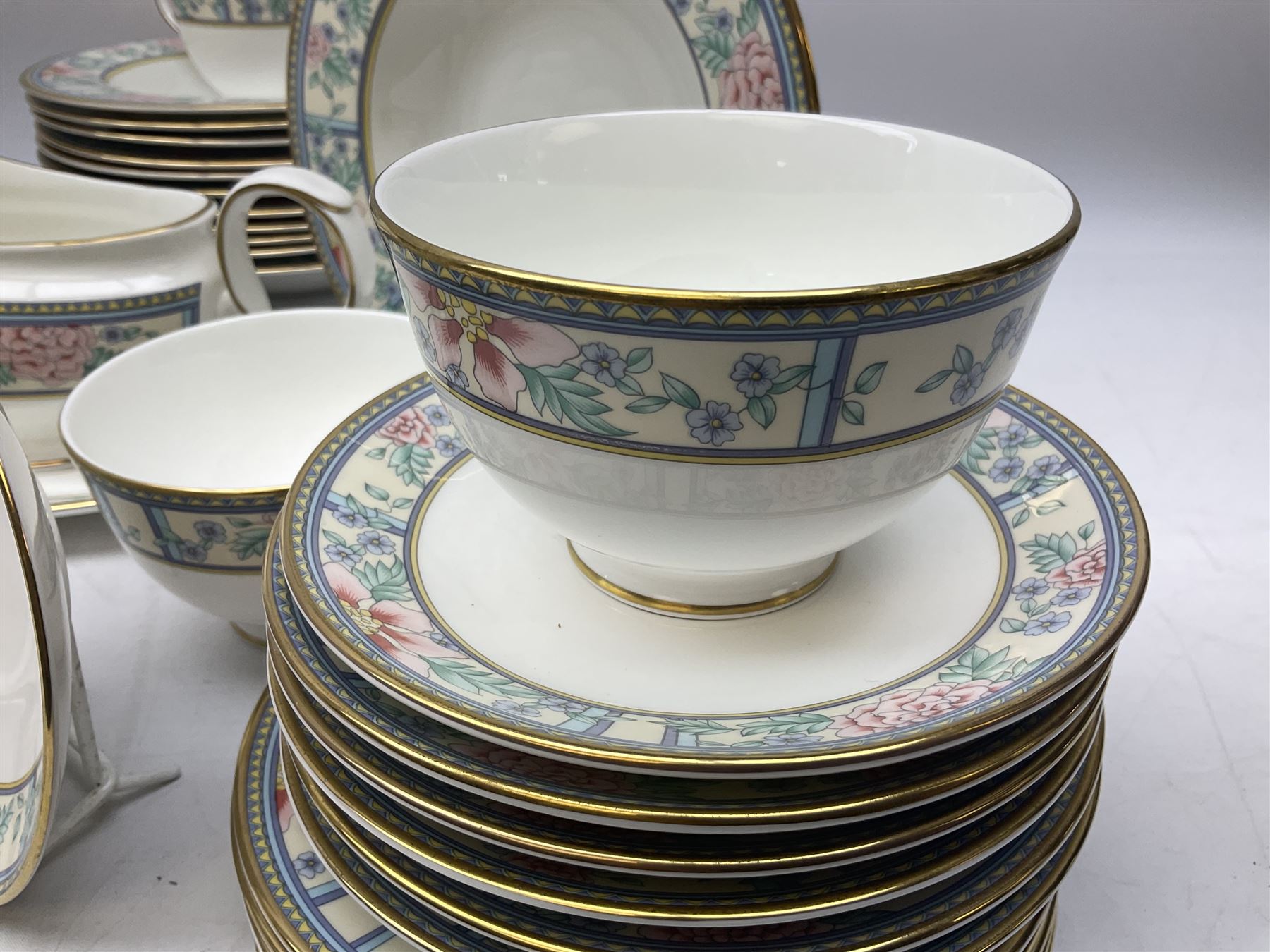 Royal Grafton tea and dinner wares decorated in the 'Sumatra' pattern, comprising twelve dinner plates, twelve lipped bowls, twelve smaller bowls, six teacups, six saucers and six plates, six coffee cups, six saucers and six plates, two milk jugs, two sucriers, sauce boat and saucer 