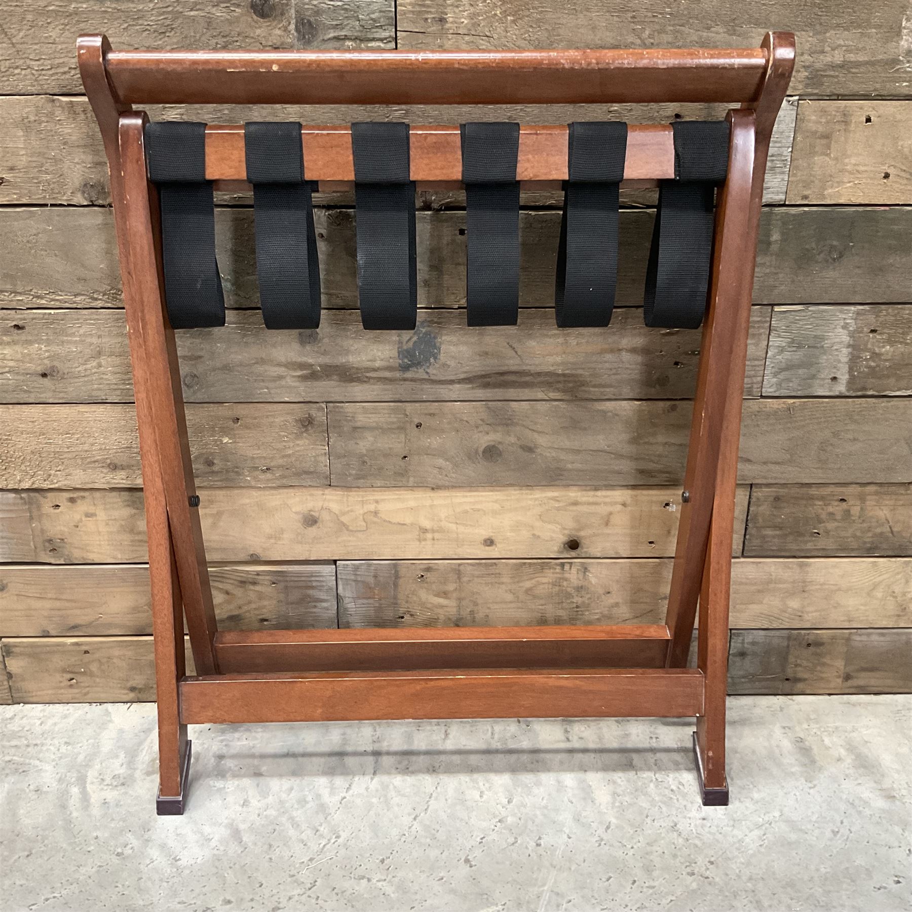 Ten walnut finish folding luggage stands