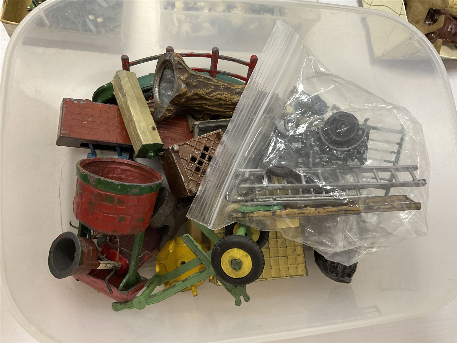 Large quantity of playworn 1950s Britains and other lead figures including farm and zoo animals, horse drawn carts, fencing etc