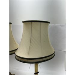 Pair of brass Corinthian column table lamps, each with cream lampshades with green piping, including shade H54cm