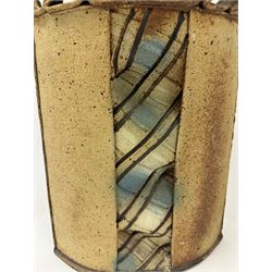 Jim Robison (American 1939-): slab built sculptural stoneware vase, of navette form with textured fabric effect decoration to centre, signed beneath, H35cm