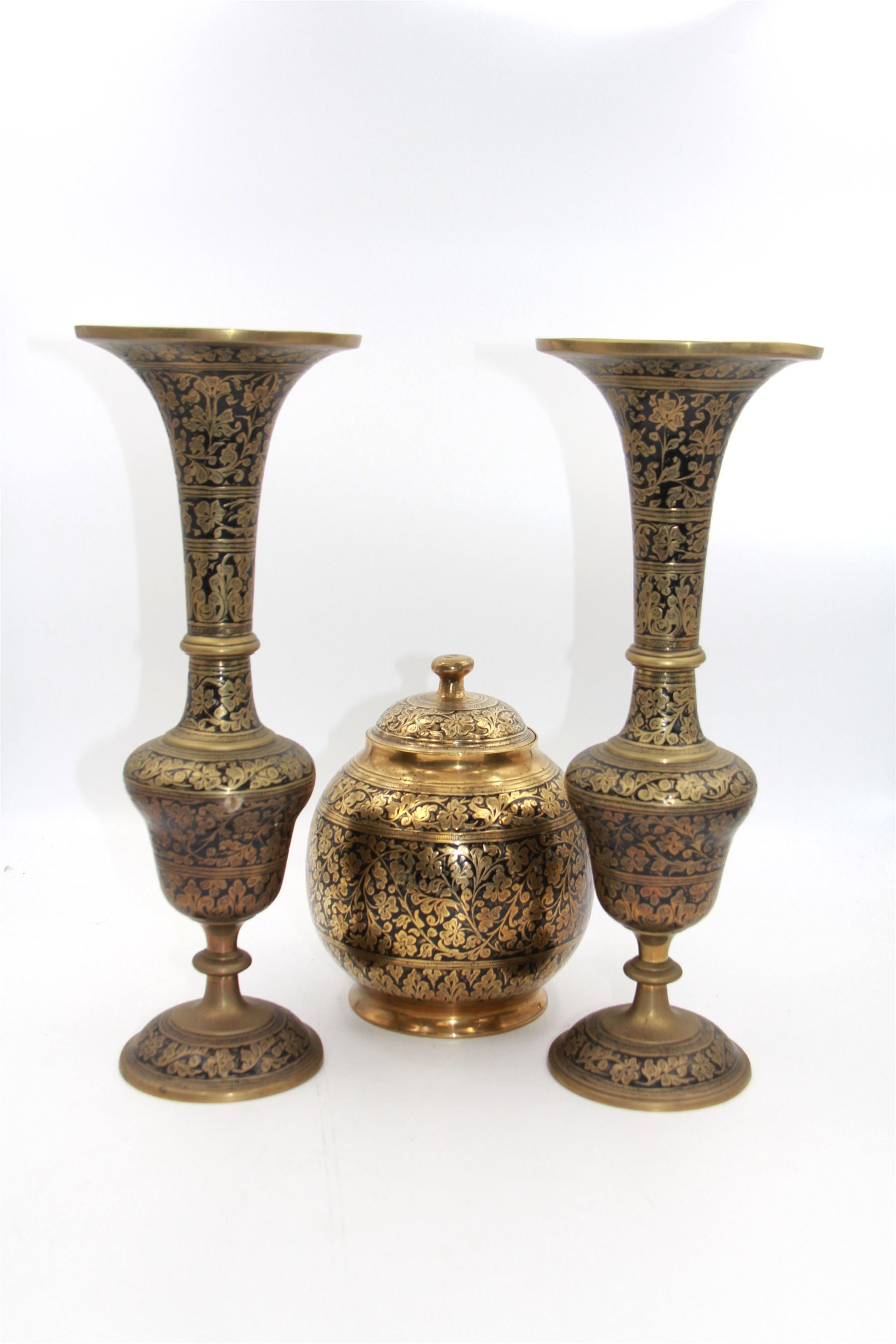 Pair of Cairo Ware vases, each of trumpet form, with foliate and black enamel decoration, together with a similar jar and cover, vases H33cm