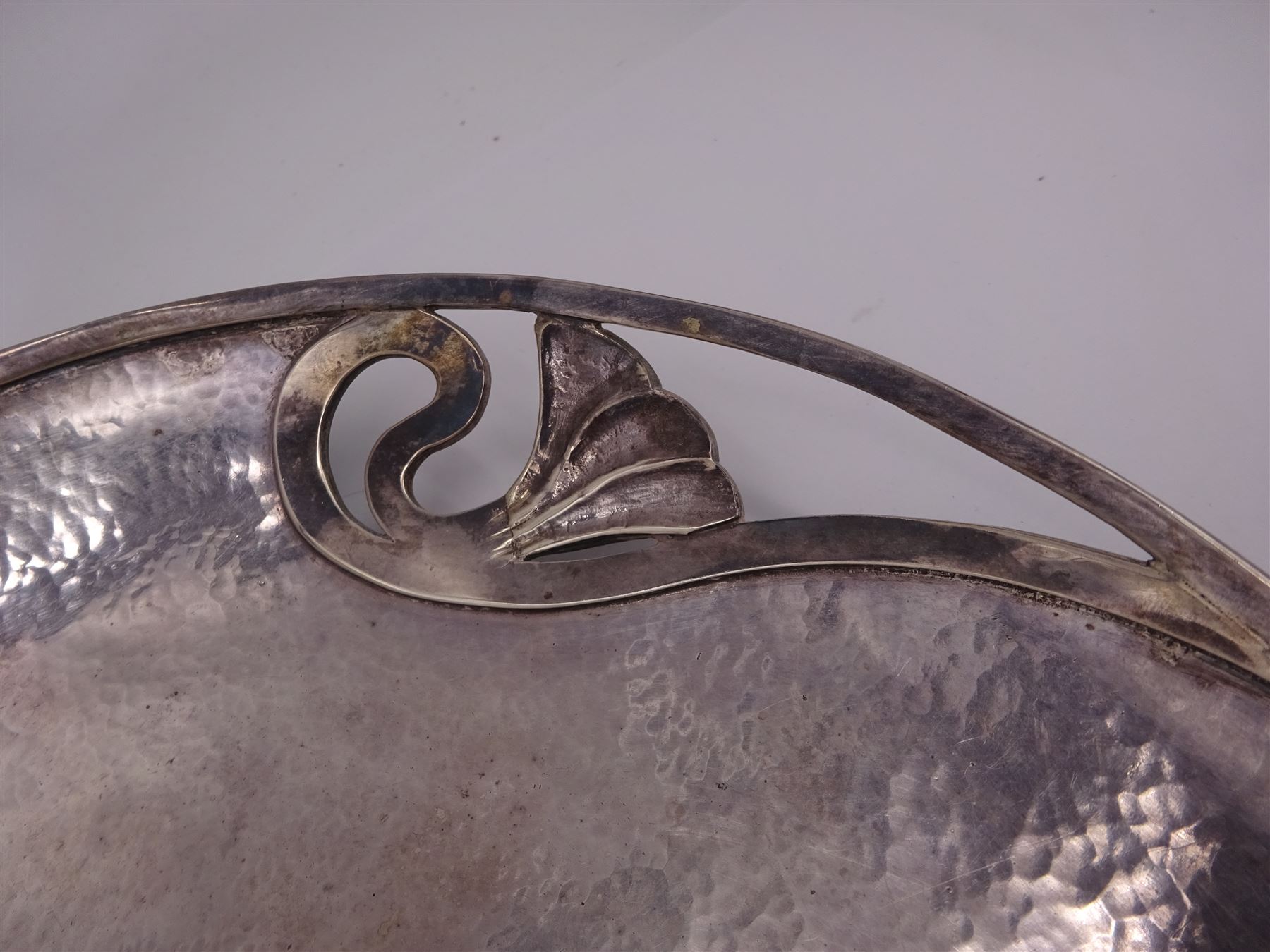 Art Nouveau style modern silver dish, of circular form with domed centre and three pierced sections each decorated with a stylised flower, with a hammered finish throughout, hallmarked Peter Cropper, London 1996, D25cm
