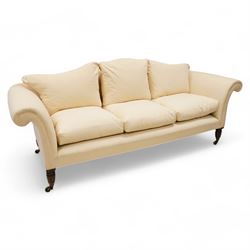 Grande three-seat camelback sofa, upholstered in calico base layer, on turned feet painted...