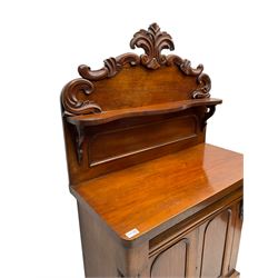 Victorian mahogany chiffonier, raised back with carved C-scroll foliage mounts and shelf, rectangular top with rounded corners over frieze drawer and double panelled cupboard, on skirted base