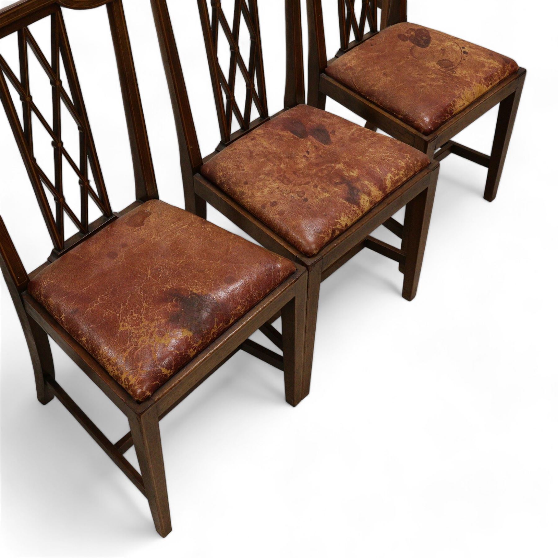 Set of six Edwardian inlaid mahogany dining chairs, lattice back with boxwood stringing, leather upholstered drop in seats