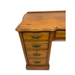 Late 19th century walnut twin pedestal desk, shaped moulded top over nine drawers, on moulded plinth base 