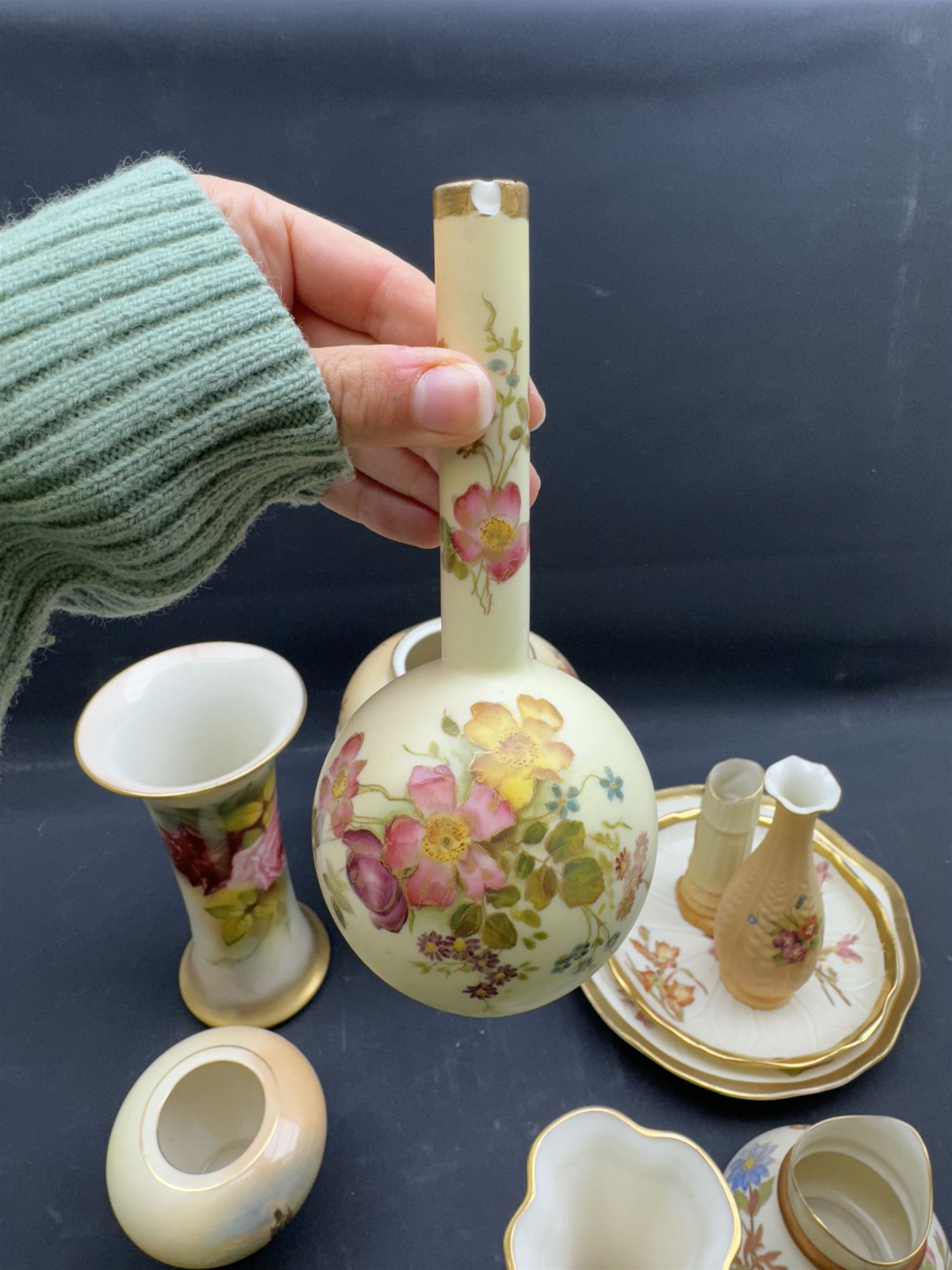 Collection of Royal Worcester Blush Ivory, including candle snuffer modelled as a monk, bamboo vase, twin handled vase etc (12)