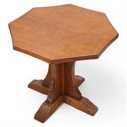 Mouseman - oak coffee table, octagonal adzed top on cruciform base and sledge feet, carved...