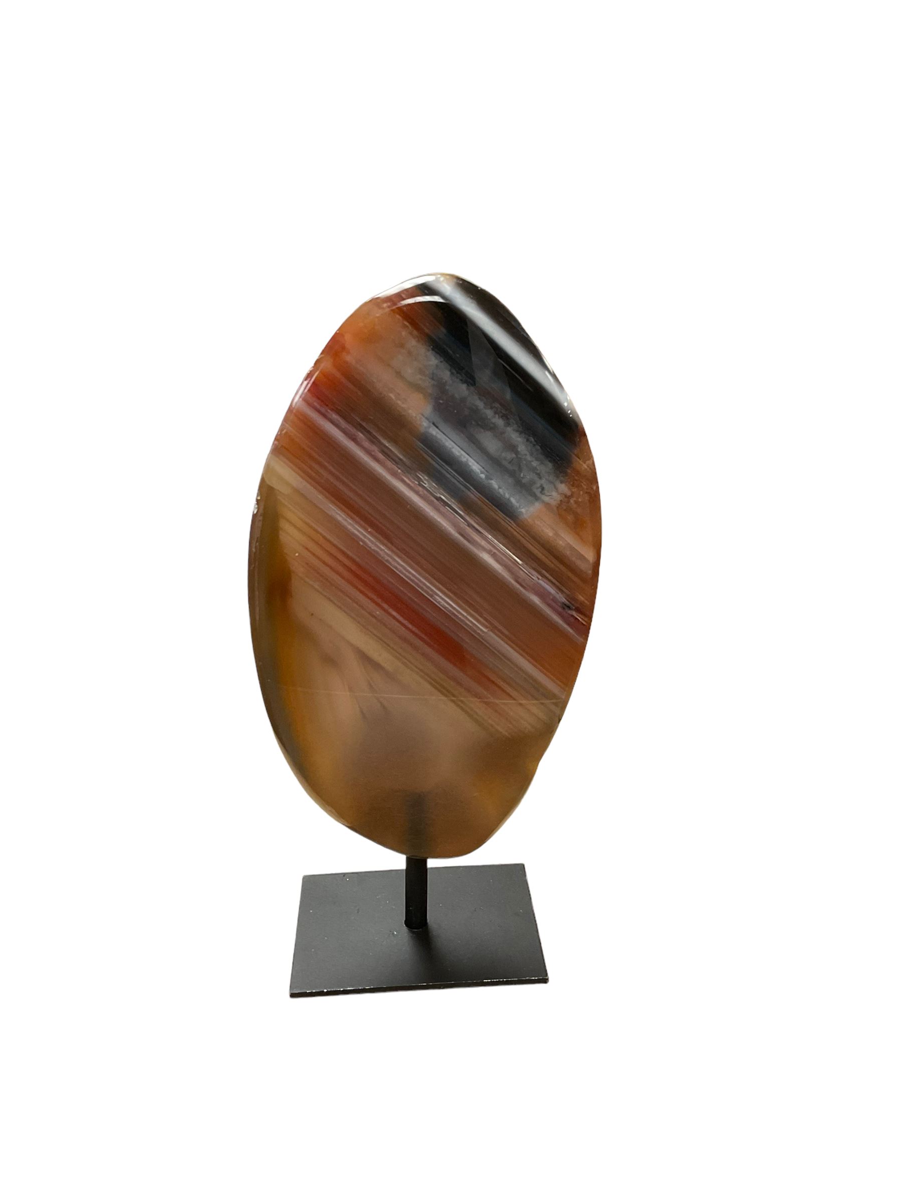 Agate crystal slice, raised on a black metal stand, H16cm