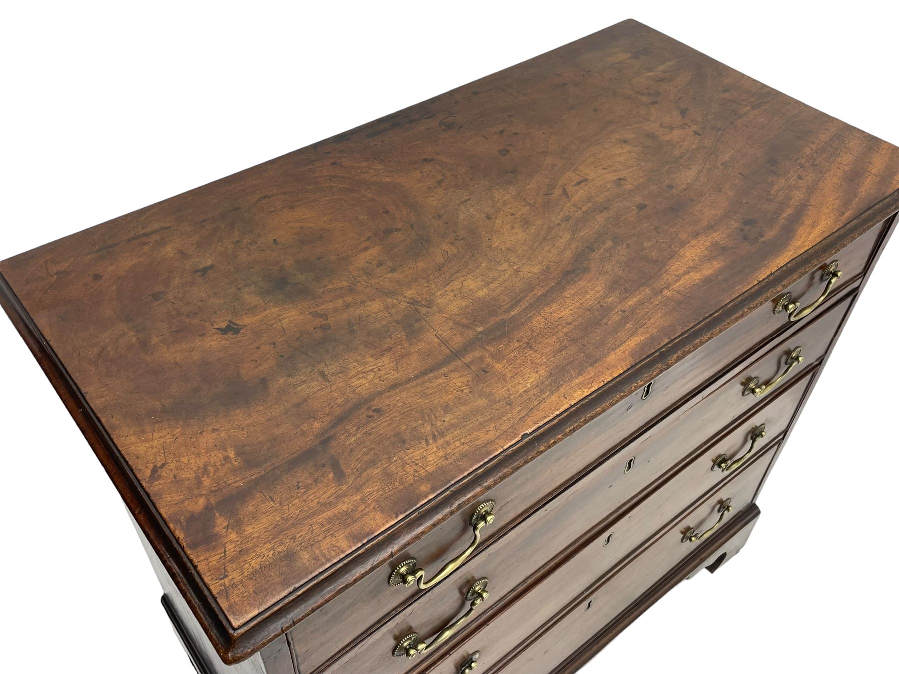 George III mahogany chest, moulded rectangular top over four long graduating cock-beaded drawers, fitted with brass swan neck handles, on bracket feet