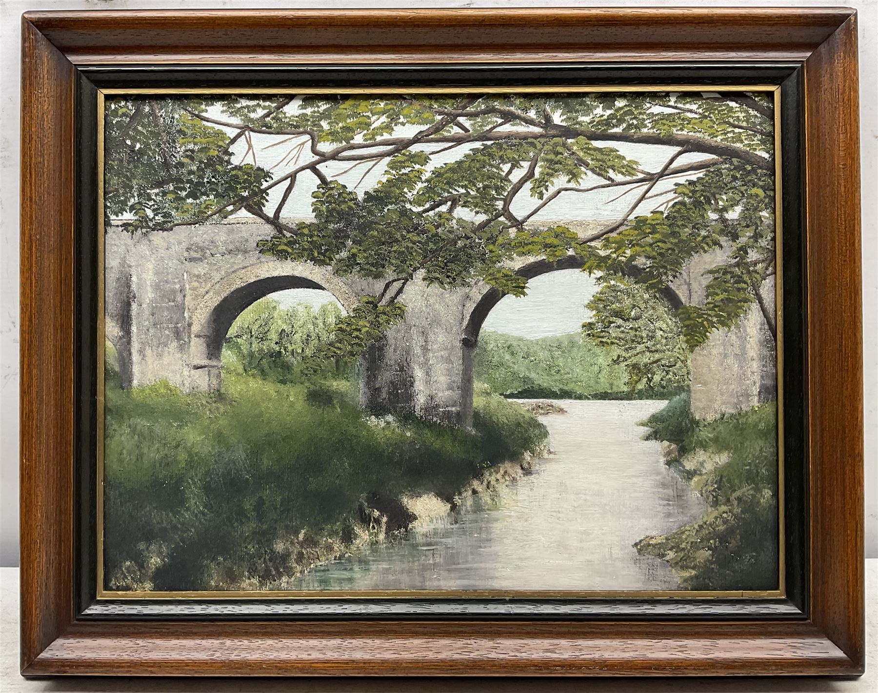 A J Wiseman (British 20th Century): Kylemore Abbey - Ireland, oil on board signed and dated 1967, 57cm x 73cm; English School (20th Century): Holne Bridge - Devon, oil on board unsigned, titled verso 28cm x 39cm (2)