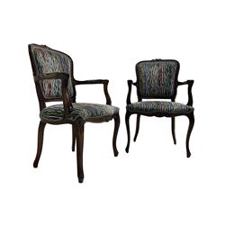 Pair of French design open armchairs, the moulded frame carved with flower heads, upholstered seat, back and arms, on cabriole supports