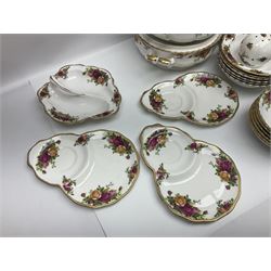 Royal Albert Old Country Roses pattern part tea and dinner service, to include two tureens, eight dinner plates, six side plates, twelve bowls, two mugs, seven teacups and saucers, milk jug,  twelve cake plates, six soup bowls and saucers, candlesticks, etc (95)