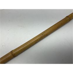 Bamboo cane torch, the pierced brass cover opening to reveal a wick, H144cm