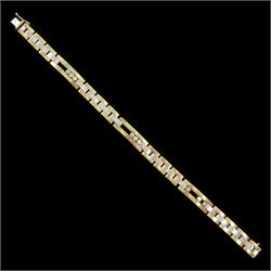 9ct white and yellow gold link bracelet, with three rectangular links, each with three sli...