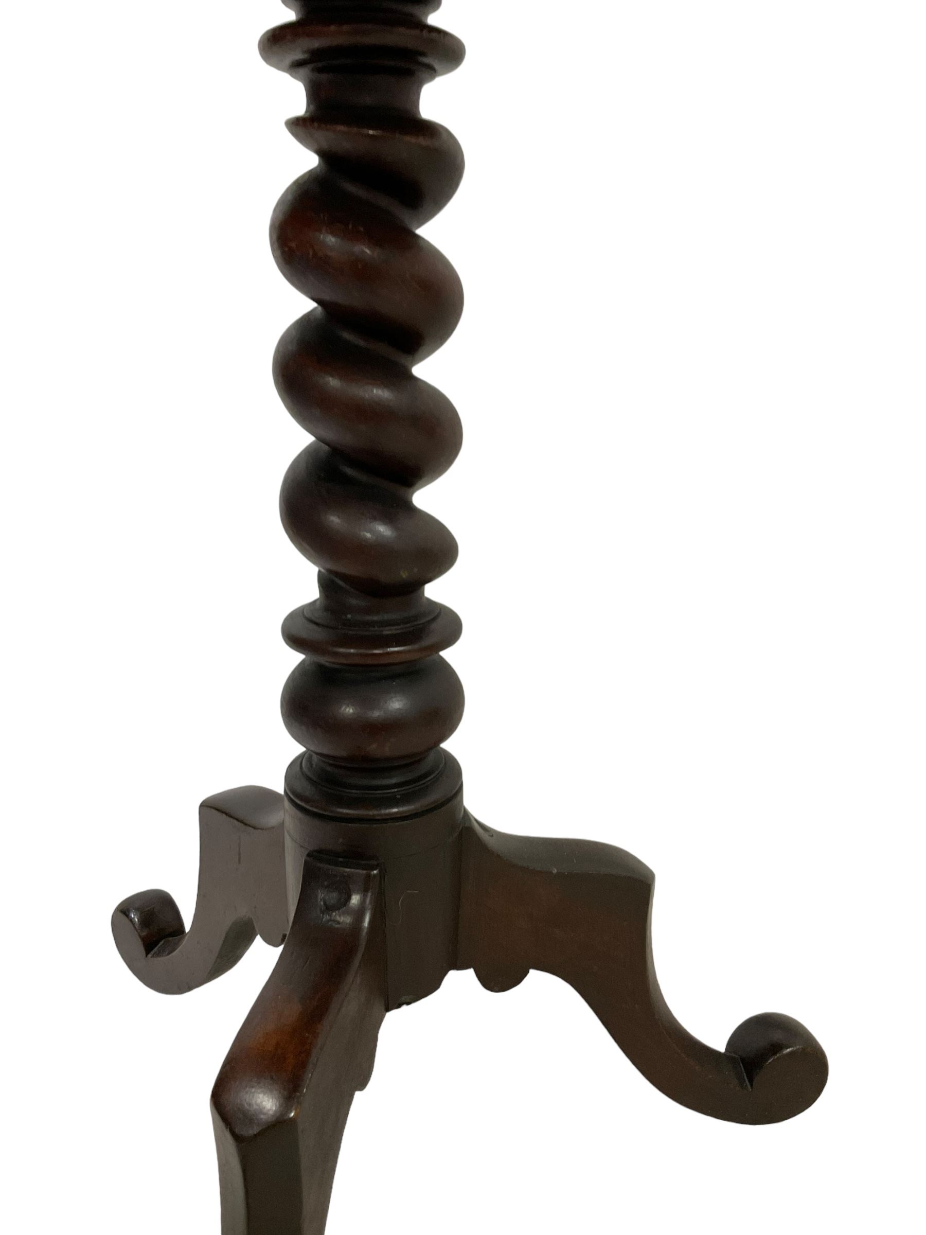 Victorian mahogany tripod table, dished circular top on spiral turned column, three splayed supports with scrolled terminals 