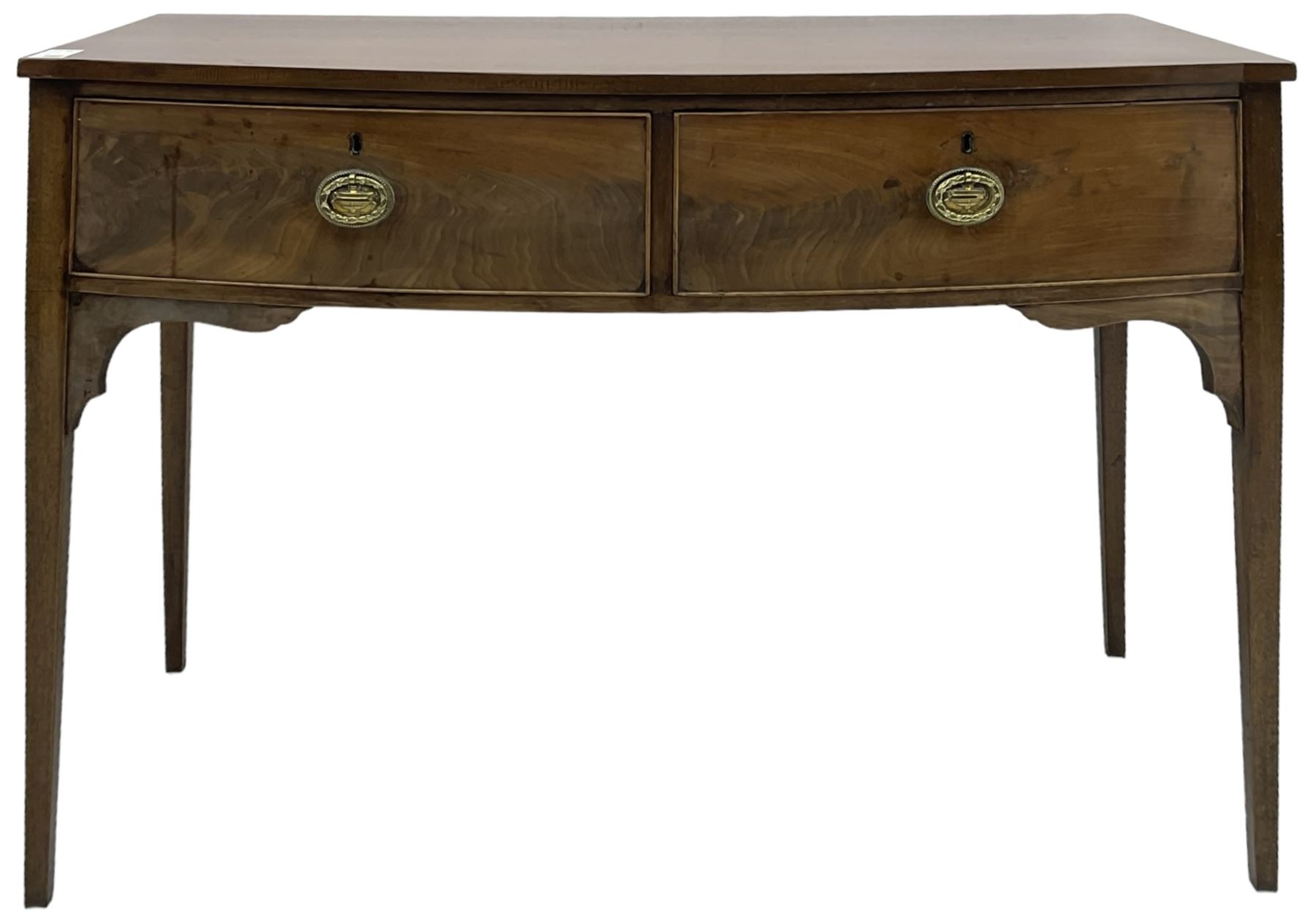 19th century mahogany bow-front serving table, fitted with two cock-beaded drawers with oval pressed brass handles decorated with urns, on square tapering supports 