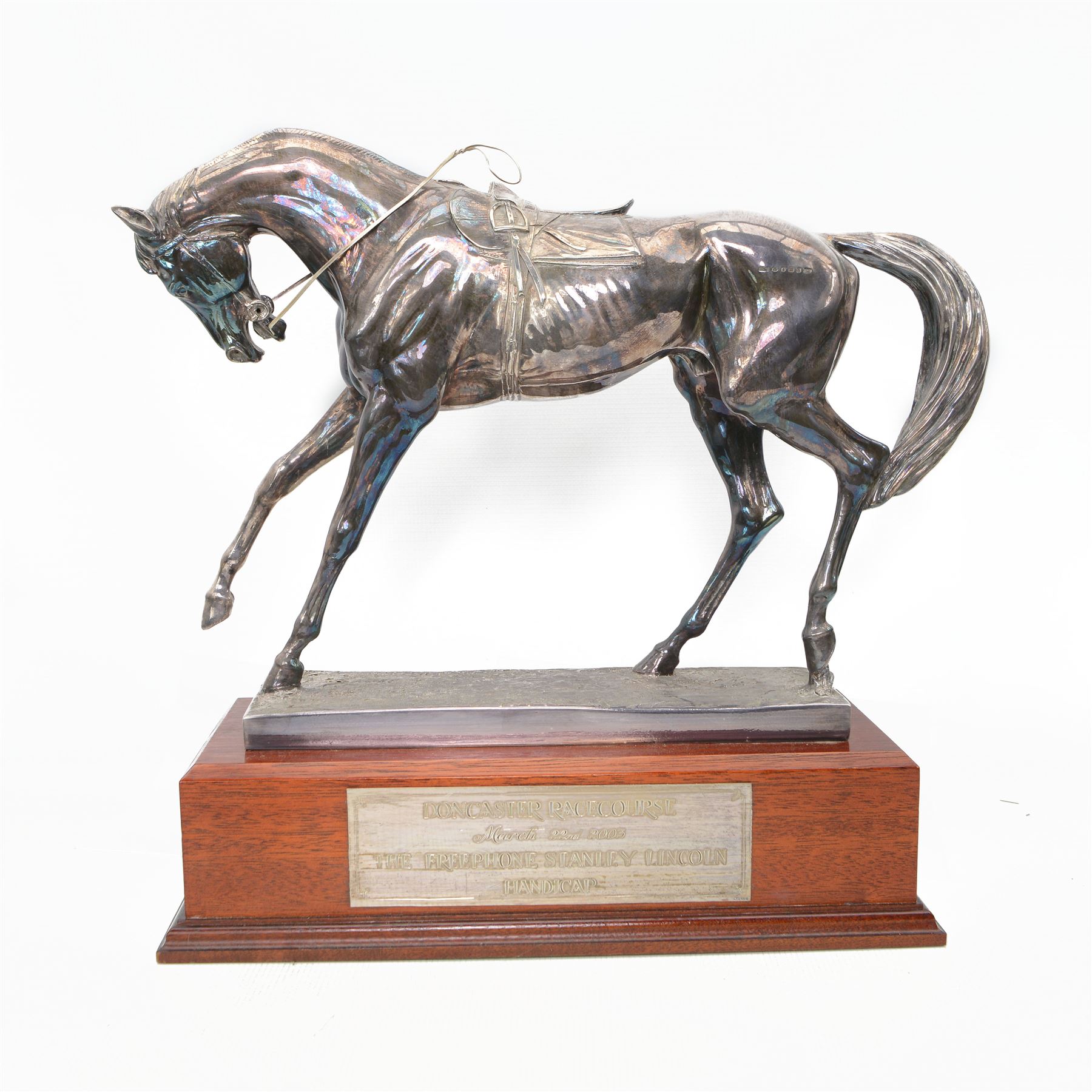 'The Freestone Stanley Lincoln Handicap Trophy, Doncaster Racecourse March 22nd 2003' - Silver filled model of a racehorse H32cm x W42cm on a mahogany plinth with silver plaque Sheffield 2003 Maker Laurence R Watson & Co.