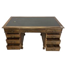 Georgian design twin pedestal desk, rectangular top with green leather inset, fitted with nine drawers, on cabriole supports with ball and claw feet 