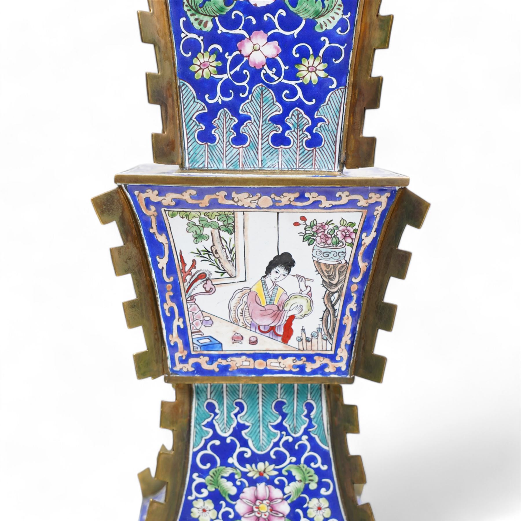 20th century Chinese brass and enamel Zun form vase, decorated with figures and birds in panels, lappet borders and trailing foliage against a blue ground, on pierced rectangular stand, H38cm