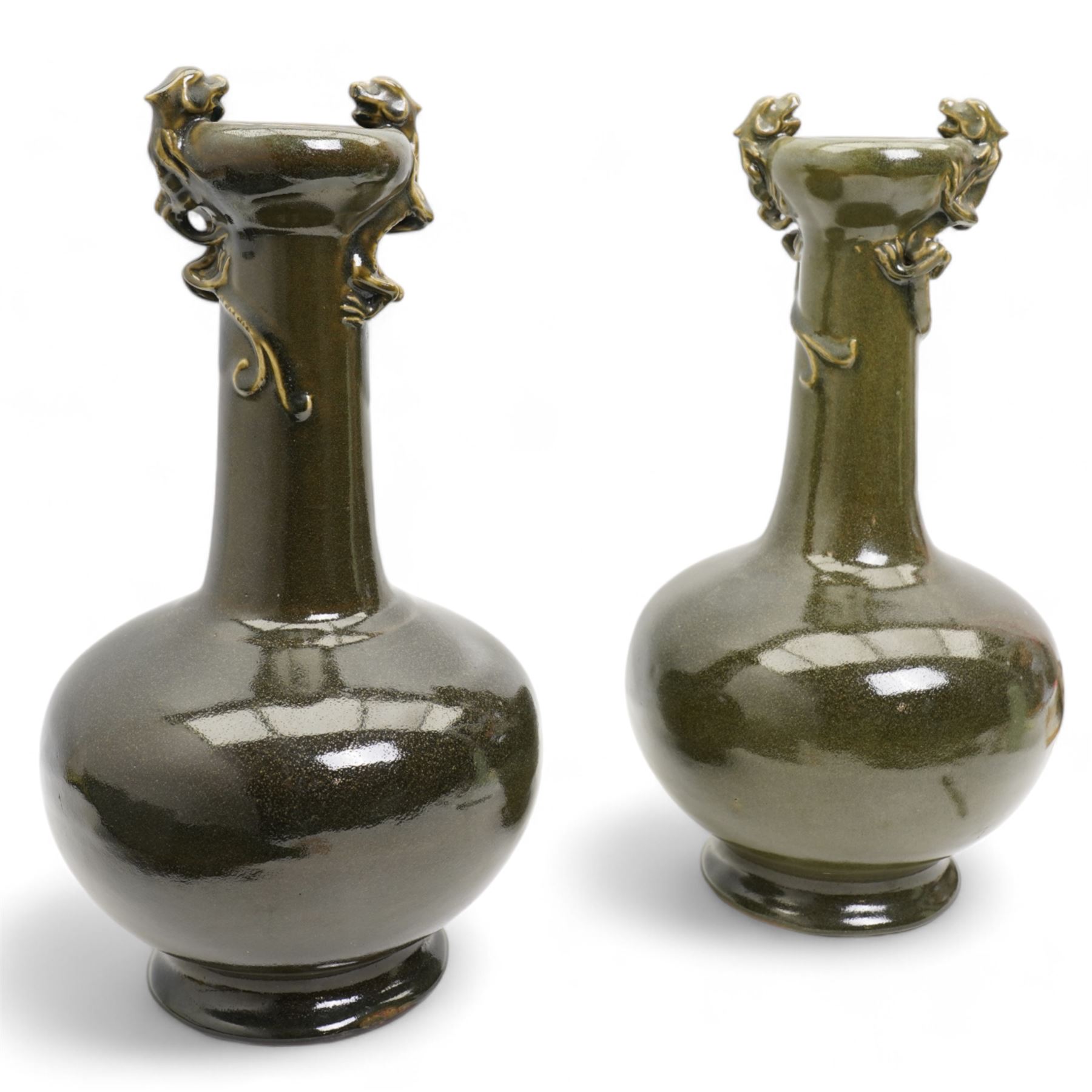 Pair of Chinese green glazed bottle vases, the compressed globular body raised on a short splayed foot and rising to a slender cylindrical neck, applied with a two coiled chilong, unmarked, H43cm 