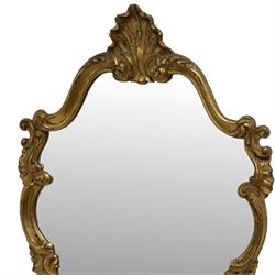 Ornate gilt framed wall mirror, shell pediment over scrolled foliate frame enclosing plain mirror plate