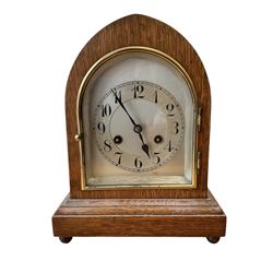 German-8-day oak cased lancet clock c 1920, with a silvered dial and chapter, striking the...