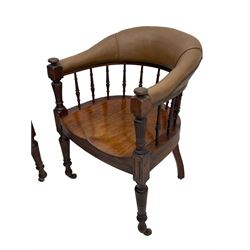 Pair of late Victorian walnut tub-shaped elbow chairs, the cushioned cresting rail upholstered in leather on spindle turned supports, dished saddle seat on turned supports