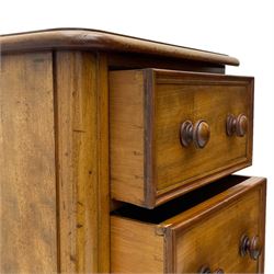 Pair of Victorian figured mahogany pedestal chests, rectangular form with rounded front corners, moulded top over three drawers with applied mouldings and turned handles, on moulded plinth base