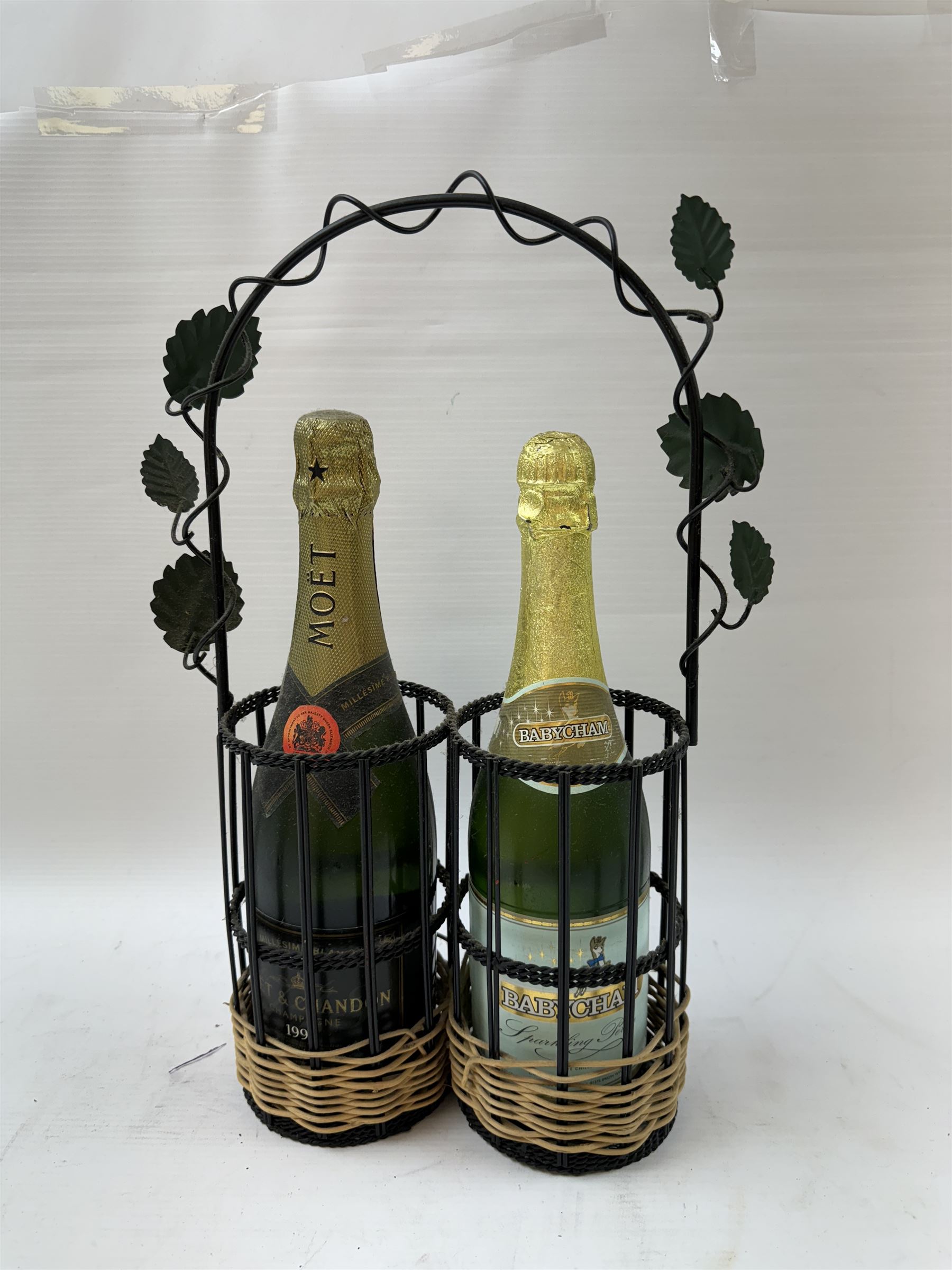 Moet & Chandon 1996 champagne, together with Babycham sparkling perry, in a wine holder, various contents and proof 