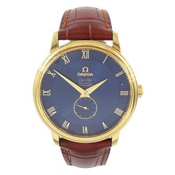 Omega De Ville gentleman's 18ct gold automatic Co-Axial chronometer wristwatch, Ref. 4613.80.02, Cal. 2202, serial No. 80844040, blue dial with Roman numeral hour markers and subsidiary seconds dial, on tan leather strap, with 18ct gold Omega buckle, boxed with cards and warranty card dated 12.06.06