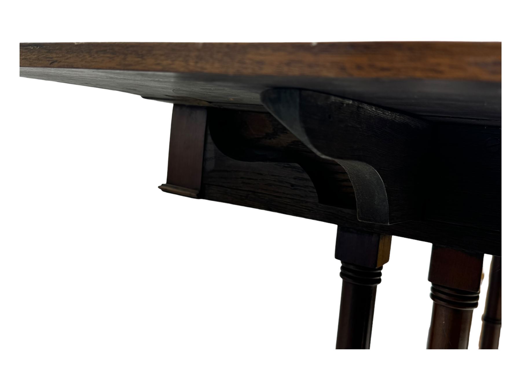 Mahogany drop-leaf sofa table, rectangular top over single frieze drawer with carved rosette handle, twin turned columns united by twin stretchers, on splayed supports terminating in paw feet with castors