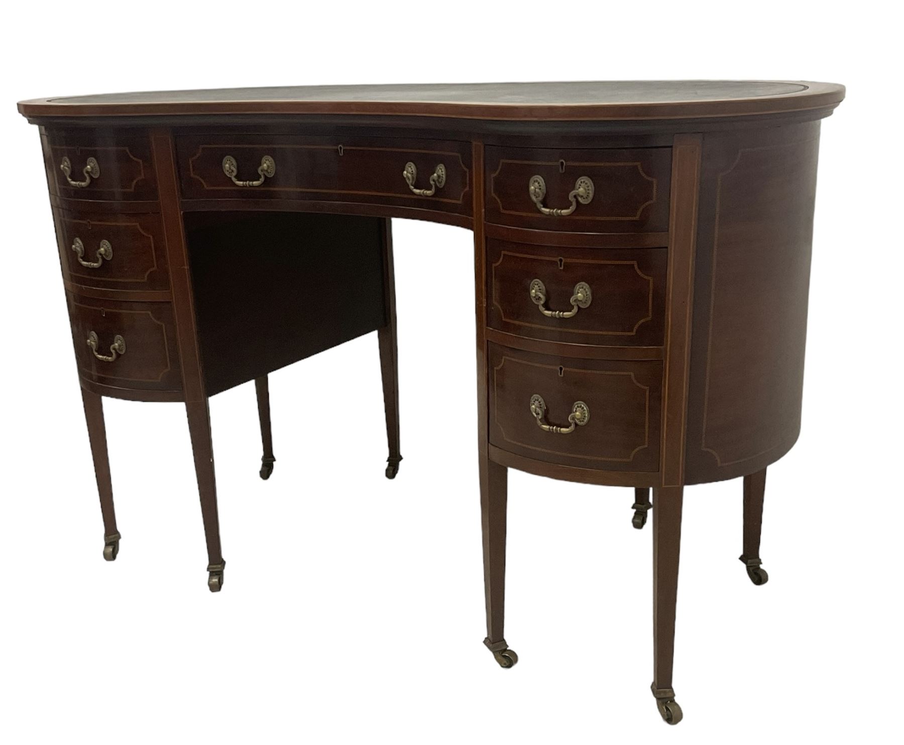 Georgian design mahogany kidney shaped desk, fitted with green leather writing surface, over single frieze drawer and six graduating drawers with checkered inlaid stringing, square tapering supports with castors